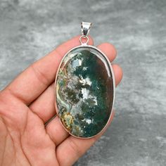 Moss Agate Pendant 925 Sterling Silver Pendant Moss Agate Gemstone Pendant Handmade Silver Jewelry Moss Agate Jewelry Gift For Her Mother The product details:- Gemstone- Moss Agate  Pendant Length- 8.5 CM Gemstone Shape- Oval (As shown in picture) Metal- 925 Sterling Silver Purity- 925 Parts Per 1000 Our Goal is 100% Customer Satisfaction  Note- "There might be a little difference in pendants as shown in photo because it is not possible for us to have the same stones." *We are continuously adding new products in our store. So keep coming back to see more great deals on store.* The perfect present for the special person in your life. Check Out Our Other Silver Pendants:- https://www.etsy.com/your/shops/JewelsByAditi/tools/listings/section:37124046 Click to visit our Shop:- https://www.etsy. Spiritual Silver Agate Gemstones, Silver Agate Pendant Gemstone, Round Moss Agate Jewelry With Natural Stones, Moss Agate Jewelry With Large Round Stone, Spiritual Silver Ocean Jasper Jewelry, Healing Agate Pendant Gemstone, Silver Moss Agate Jewelry With Cabochon, Silver Moss Agate Cabochon Jewelry, Silver Moss Agate Jewelry With Natural Stones