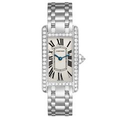 Cartier Tank Americaine White Gold Diamond Ladies Watch WB7073L1. Quartz movement. 18K white gold case 19.0 x 35.0 mm. Octagonal crown set with original Cartier factory faceted diamond. . Scratch resistant sapphire crystal. Silvered grained dial with black Roman numeral hour markers and an inner minute track. Sword-shaped blued steel hands. 18K white gold bracelet with hidden butterfly clasp. Fits a 6" wrist. Cartier Tank Americaine, Cartier Ballon Bleu, Rolex Air King, Cartier Tank, Cartier Watch, White Gold Bracelet, Gold Case, Bezel Diamond, Ladies Watch