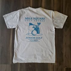 "Vintage graphic tshirt Reads \"Mile Square Golf Course Junior Golf Camp\" Tag Youth XL, fits like adult XS/S Excellent condition, no flaws to note Measurements: Length from high point shoulder 25\" Shoulders across at seams 16.5\" Sleeve length from shoulder seam 7.5\" Armhole drop 9.5\" Sleeve opening 6.75\" Chest across at armpit 18.5\" Hem across 19\"" Tee Design Print, Vintage Graphic Tshirt, Golf Camp, Golf Tshirt, Golf Poster, Camping Tee, Golf Design, Vintage Golf, Golf Tees