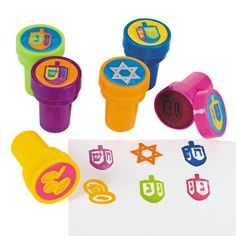 colorful rubber stamps with letters and symbols on them