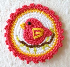 a crocheted ornament with a bird on it