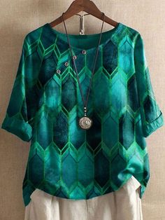 Spring Blouse With Geometric Pattern, Casual Geometric Tops For Spring, Casual Green Tops With Geometric Pattern, Spring Green Blouse With Asymmetrical Hem, Green Asymmetrical Hem Blouse For Spring, Casual Green Top With Geometric Pattern, Green Blouse With Asymmetrical Hem For Summer, Green Geometric Pattern Tops For Summer, Batik Shirt