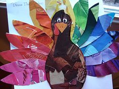 a turkey made out of colored paper on a table