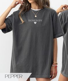 Aesthetic minimal homebody tshirt for women.  Available in the colors: Ivory, White, Pepper & Black. Comfort Colors unisex loose fit. True to size.  Size up for an oversize fit.  The soft-washed, garment-dyed fabric brings extra coziness to your wardrobe while the relaxed fit makes it an excellent daily choice.  ~made with 100% ethically grown, ring-spun US cotton for long-lasting comfort. ~relaxed fit  ~pre-shrunk fabric ensures a consistently great fit All t-shirts are made to order and can on Grey Magic, Pepper Color, Pregnancy Announcement Shirt, Mama T Shirt, Wild Free, Mama Shirts, Team Bride, Dye T Shirt, Martini