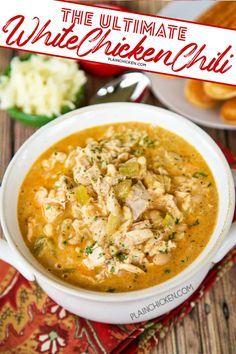 the ultimate white chicken chili in a bowl with bread and other food on the side