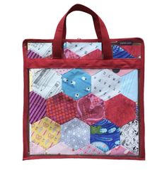 a red and white bag with patchwork designs on the front, featuring an image of hexagons