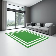 a living room with a couch and green rug