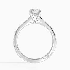 a white gold engagement ring with an oval shaped diamond