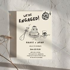 a wedding card with an image of a cake and the words we're engaged on it