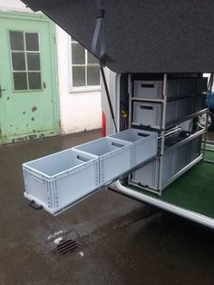 the back end of a trailer with storage compartments