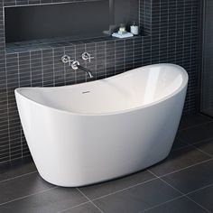 a white bath tub sitting on top of a tiled floor