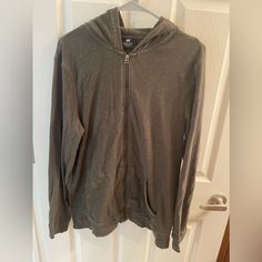 Olive Green Zip Up Hoodie. It Looks Grey In The Photo Due To Lighting. Great Condition Never Worn, Just Kept Hung In The Closet. Very Light Weight Perfect Or Fall Or Early Spring! Green Zip Up Hoodie, In The Closet, The Closet, Early Spring, Zip Up Hoodie, Colorful Hoodies, Olive Green, Zip Ups, H&m