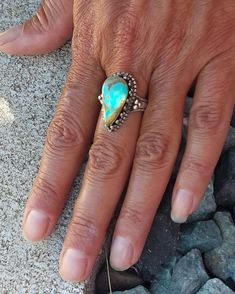 WANTED all over the Universe. Turquoise is recognized Sought After by early KINGS, MOVERS, and SHAKERS! Turquoise is said to be a vessel Imbued with energies associated with Heaven! All My Turquoise is Carefully chosen from around the World. I love the Raw Authentic look and feel of the stone...so I do not over polish the Turquoise! True Bohemian Style...an Original work of Art that you can treasure for a lifetime! Each of My Creations are One of A Kind and are Hand wrought to bring out the best Handmade Turquoise Opal Ring Artisan Style, Handmade Turquoise Artisan Opal Ring, Handmade Artisan Turquoise Opal Ring, Handmade Turquoise Opal Bohemian Ring, Handmade Southwestern Opal Ring, Handmade Turquoise Opal Ring With Unique Style, Bohemian Adjustable Teardrop Turquoise Ring, Untreated Bohemian Turquoise Ring, Bohemian Teardrop Turquoise Adjustable Ring