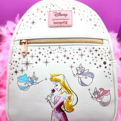 the back side of a white backpack with princesses on it and stars in the background