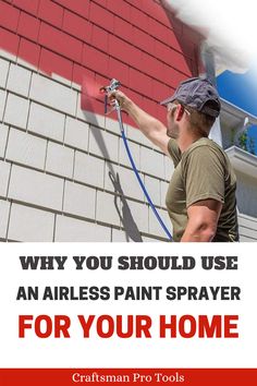 a man spraying paint on the side of a house with a red and white banner