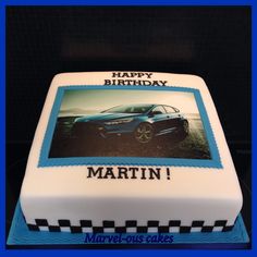 a birthday cake with a photo of a car on it