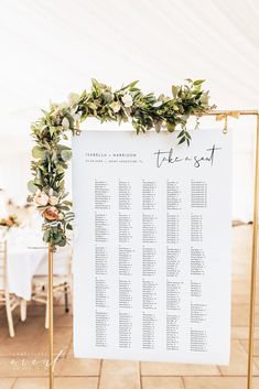 a seating chart with greenery on it