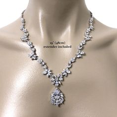 "A piece of woodland wedding nature inspired statement bridal necklace featuring vines, leaves parts and flower pendant, made of sparkly clear cubic zirconia. This beautiful cz jewelry comes in tarnish-resistant silver rhodium plated chain. Necklace length options: - 17\" (43cm) with a snap clasp - 19\" (48cm) including a 2\" chain extender on a spring clasp (as shown on display). View matching pieces or similar designs at https://etsy.me/2eR38KG View designs related to vines, branches, twigs or Classic Bridal Necklace With Sparkling Stones For Anniversary, Formal Sparkling Cubic Zirconia Bridal Necklace, Elegant Sparkling Cubic Zirconia Bridal Necklace, Dazzling Sparkling Cubic Zirconia Bridal Necklace, Elegant Sparkling Diamond Necklace For Wedding, Elegant Sparkling Diamond Wedding Necklace, Wedding Crystal Diamond Necklace With Sparkling Detail, Wedding Crystal Diamond Necklace, Wedding Crystal Diamond Necklace Sparkling