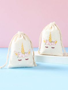 two bags with unicorns on them sitting next to each other