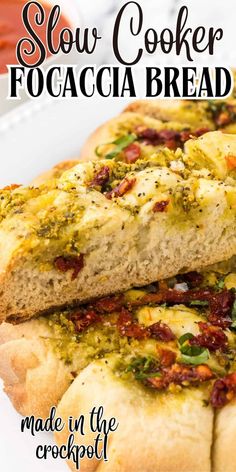 two pieces of bread with pesto and cheese on them sitting on a white plate