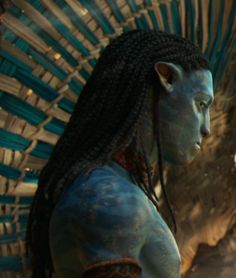 the character avatar from avatar is standing in front of an alien like creature with long hair