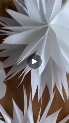 an image of white paper flowers on a table