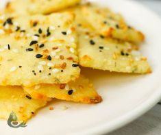 some food is on a white plate with black sesame sprinkles and seasoning