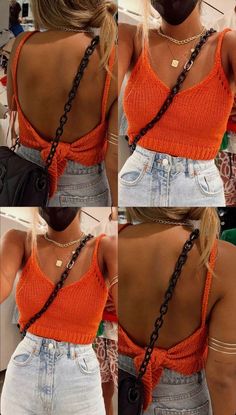 the back of a woman's orange top with chains on her neck and shoulder