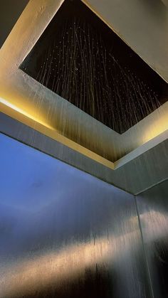 an open shower head with water sprinkles on it