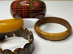 Gorgeous 4 piece collection of vintage bangles. Mid-century Bangle Bracelet For Gift, Mid-century Bangle Bracelets As Gifts, Vintage Brown Cuff Bracelet For Formal Occasions, Vintage Brown Bracelet Gift, Vintage Brown Bangle As A Gift, Adjustable Brown Vintage Bangle, Vintage Bangles, Vintage Bracelet, Vintage Bracelets