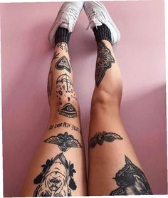 the legs and ankles of a woman with tattoos