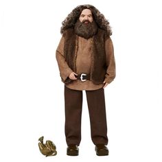 a man with a beard and mustache standing next to a toy frog on a white background