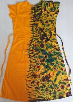 Hand made Cotton Batik Frock/ Wrap for Women Yellow Cotton Dress With Batik Print, Fitted Bohemian Dress With Bandhani Print, Green Batik Print Dress For Festival, Green Festival Dress With Batik Print, Yellow Bohemian Dress With Batik Print, Multicolor Bandhani Print Dresses For Festival, Traditional Yellow Dress With Batik Print, Cotton Batik Print Short Sleeve Maxi Dress, Cotton Maxi Dress With Short Sleeves And Batik Print