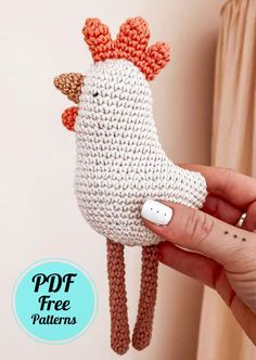 a hand holding a crocheted chicken doll in it's right hand with the text, free pattern