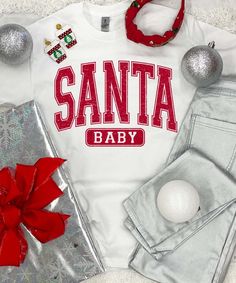 Introducing our "Distressed Santa Baby Graphic Shirt," a stylish and festive addition to your Christmas wardrobe. 
The "Distressed Santa Baby Graphic Shirt" is the perfect choice for embracing the joy of the holiday season with a classic touch. Whether you're attending Christmas parties, exchanging gifts, or simply want to showcase your love for Santa Claus, this shirt allows you to do so with style. Its distressed design adds a vintage and timeless element to your Christmas outfit, making it ideal for those who appreciate both style and the magic of Christmas.
Embrace the festive spirit and celebrate the magic of Santa with the "Distressed Santa Baby Graphic Shirt." Whether you're a dedicated Christmas enthusiast or simply enjoy classic and stylish apparel, this shirt caters to those Christmas Wardrobe, Cute Christmas Shirt, Cute Christmas Shirts, Beach Birthday, Black Friday Christmas, Santa Baby, Christmas Parties, Gift Exchange, Graphic Shirt