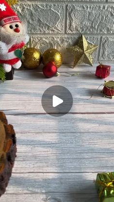 an image of christmas decorations and presents on a table with a video player in the foreground