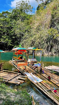 there is a boat that is on the water and some rafts are in the water