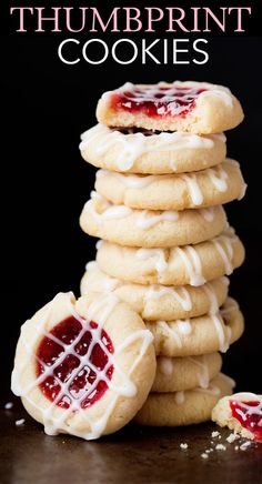 a stack of cookies with white icing and jelly on top