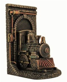 an old fashioned steam engine figurine is shown