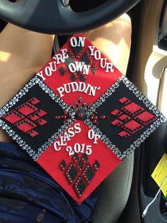 a red and black graduation cap that says you're on your own riddin class of 2015