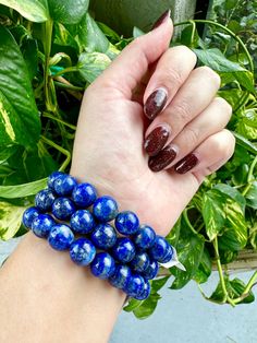 🌟 Welcome to Shine Bright Crystals! 🌟 Stay updated on our newest arrivals and exciting giveaways by following us on Instagram: @ShineBrightCrystals Bracelet will be intuitively chosen for you. 📏 Approximate Bead Size:   11.3mm - 11.5mm Elevate your accessory game with our Lapis Lazuli Bracelet, featuring majestic 11.3mm beads. This luxurious bracelet not only stands out with its deep blue hues and natural golden flecks but also embodies the essence of wisdom, truth, and spiritual enlightenment. A perfect blend of style and soulful energy, it's designed to connect you more deeply with your inner self and the universe. 💙✨  * Regal Design: The 11.3mm Lapis Lazuli beads offer a bold and regal    appearance, making this bracelet a statement piece of jewelry.  * Wisdom and Truth: Lapis Lazul Blue Crystal Bracelet With Polished Round Beads, Blue Stretch Bracelet With Polished Beads As Gift, Gift Blue Stretch Bracelet With Polished Beads, Sapphire Jewelry With 8mm Beads, Blue Polished Beads Round Bracelet, Blue Spiritual Bracelets With Large Beads, Sapphire Lapis Lazuli Bracelets With Round Beads, Blue Polished Beads Bracelet, Blue Stretch Bracelet With 8mm Beads For Jewelry Making