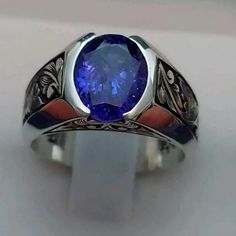 a ring with a blue stone in the center