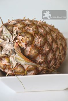 a pineapple sitting on top of a white plate