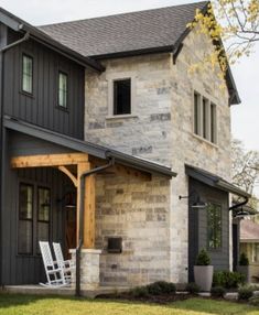 the front of a house with a white rocking chair