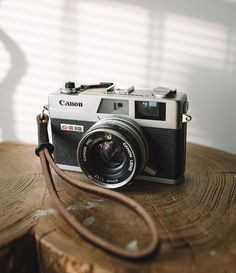 a camera sitting on top of a wooden table