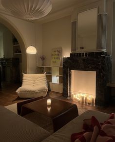 a living room filled with furniture and a fire place