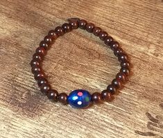 Wooden beaded Prayer bracelet inspired from Twilight movie! It is a perfect final touch for your Bella Swan look!   - made from red sandalwood  - porcelain blue bead Red Sandalwood, Twilight Film, Bracelet Inspired, Prayer Bracelet, Twilight Movie, Porcelain Blue, Bella Swan, Wedding Jewelry Bracelets, Final Touch