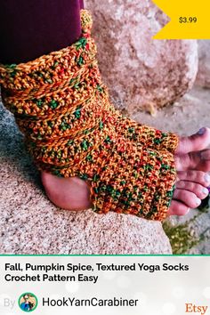 a person wearing crocheted barefoot sandals on top of a rock