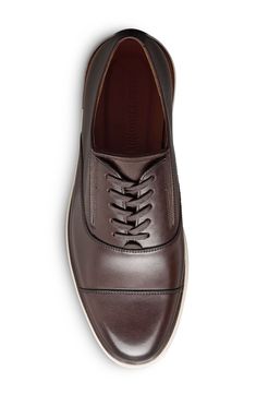 A rich leather upper and streamlined silhouette lend timeless sophistication to a versatile slip-on oxford grounded by a durable rubber sole. Slip-on style with elastic gore insets Removable, cushioned insole with arch support Leather upper and lining/rubber sole Imported Classic Slip-on Oxfords With Rubber Sole, Slip-on Oxfords With Rubber Sole, Slip-on Cap Toe Oxfords With Rubber Sole, Timeless Slip-on Oxfords With Leather Sole, Classic Slip-on Oxfords For Business, Slip-on Oxfords For Derby, Business Slip-on Low-top Oxfords, Slip-on Oxfords With Brogue Detailing And Cap Toe, Slip-on Low-top Oxfords For Business