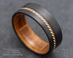 Make the Vertex ring the centerpiece of your wedding ceremony and embrace the elegance and character it brings to your love story. This 7mm handcrafted ring boasts a CarbonUni core for unrivaled strength, and performance. Completed with a striking yellow gold rope inlay, and a whiskey barrel oak inner sleeve, this ring creates a timeless symbol of your commitment. ✯ This ring is made with the following options: ◎ Core ⤚ ⟶ CarbonUni ❍ Inner Sleeve ⤚ ⟶ Whiskey Barrel Oak ║ Inlay ⤚ ⟶  14K Yellow Go Carbon Fiber Mens Ring, Carbon Fiber Rings, Dinosaur Bones, Resin Coating, Whiskey Barrel, Handcrafted Rings, Elegant Ring, Ring Box, Perfect Ring